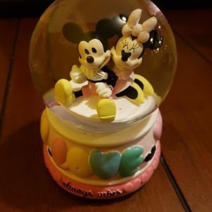 A mickey and Minnie snow globe